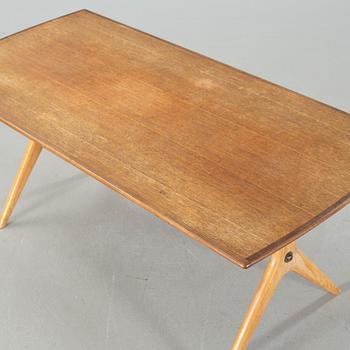 A "Krysset" sofatable, designed by Karl-Erik Ekselius for JO Carlsson, launched 1952.