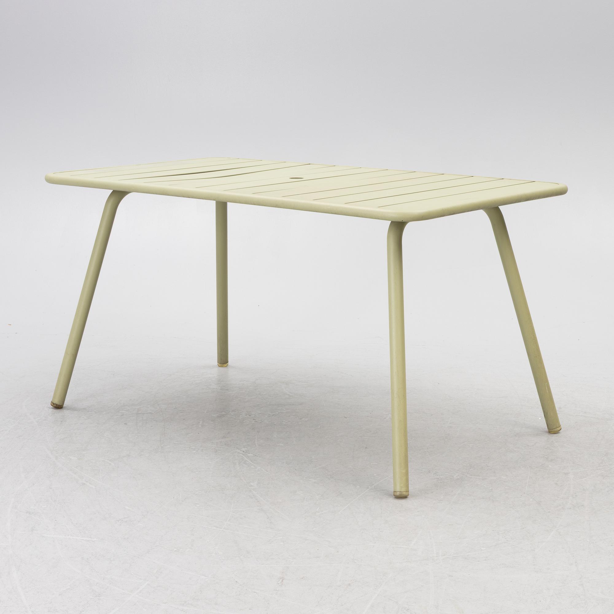 Frédéric Sofia, a table and two chairs for outdoor use, "Luxembourg" Fermob, France, 21st century.