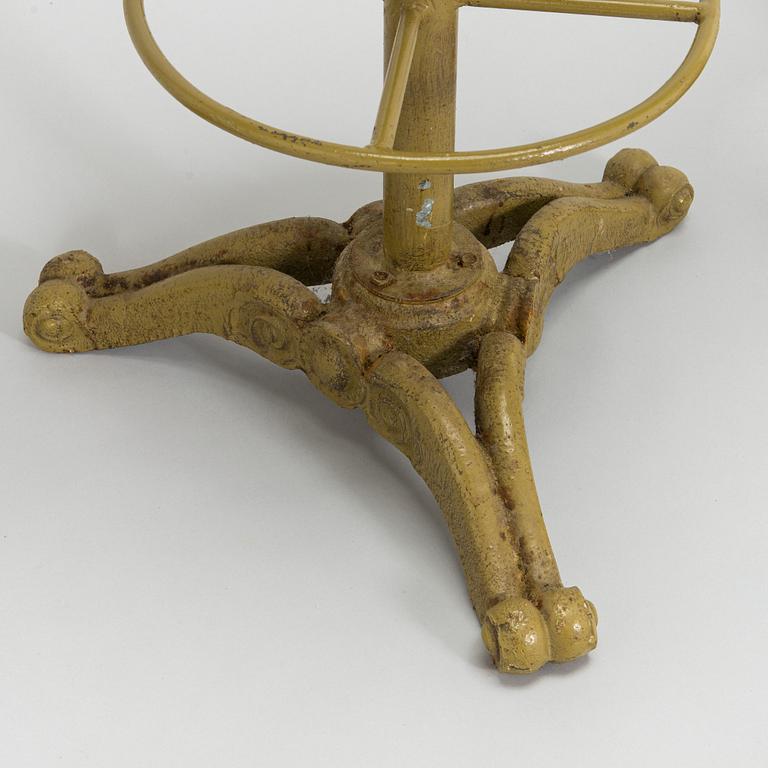 Four bar stools, painted cast iron, partly from the early 20th century.
