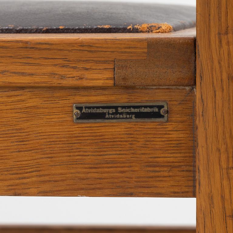 An oak writngdesk with a chair from Åtvidabergs, first part of the 20th century.