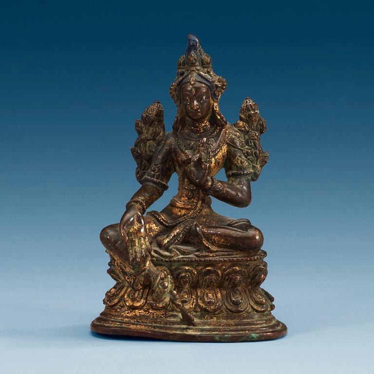 A Sinotibetan gilt bronze figure of green Tara, 18th/19th Century.