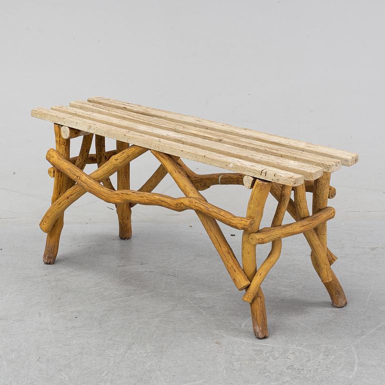 A wooden garden bench, 20th Century.