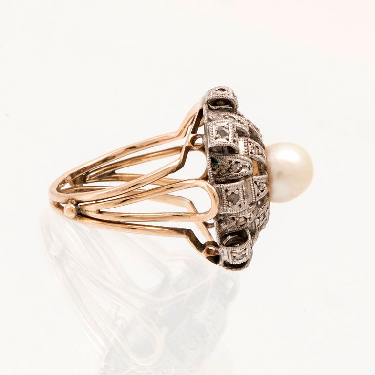 A ring set with a cultured pearl and rose-cut diamonds.