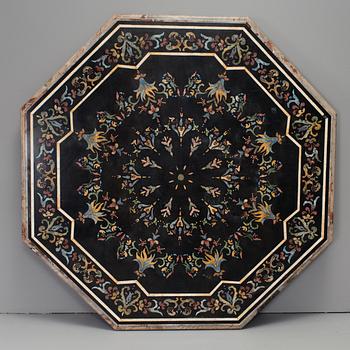 An oktagonal stone table top with inlays, Italy, about 1900.