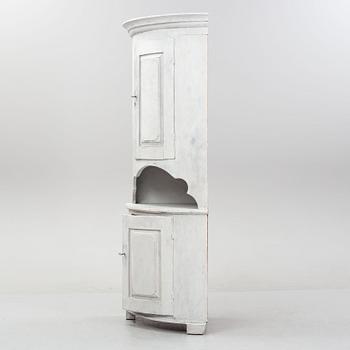 An 19th Century corner cabinet.