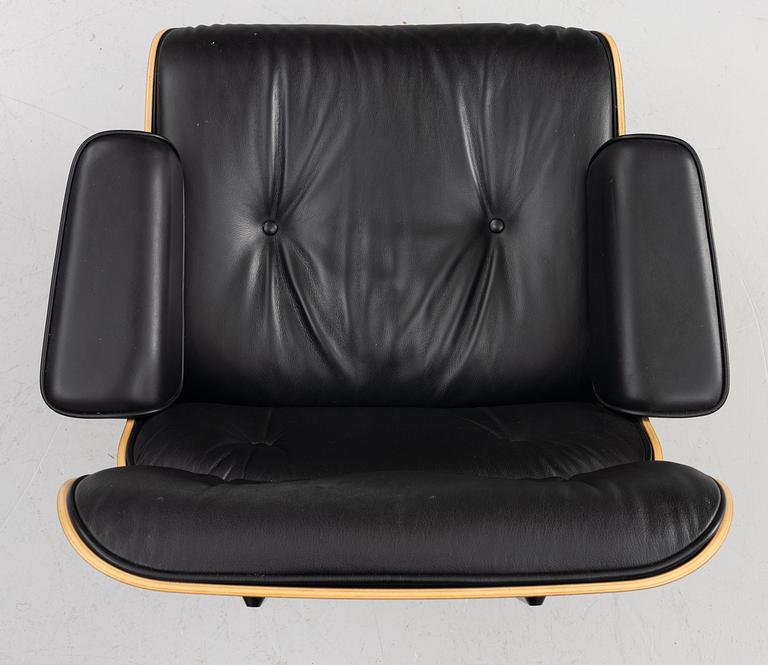 Charles & Ray Eames, Armchair with ottoman, "Lounge chair", Vitra, 21st century.