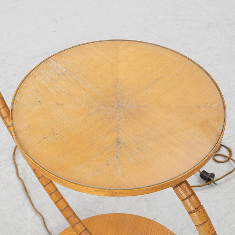 A 1930's/40's floor lamp with table.