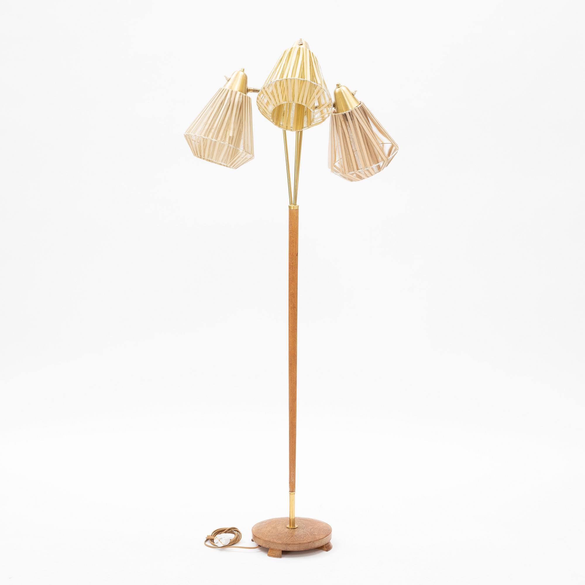 An oak three armed floor lamp from AB Armaturhantverk Göteborg.