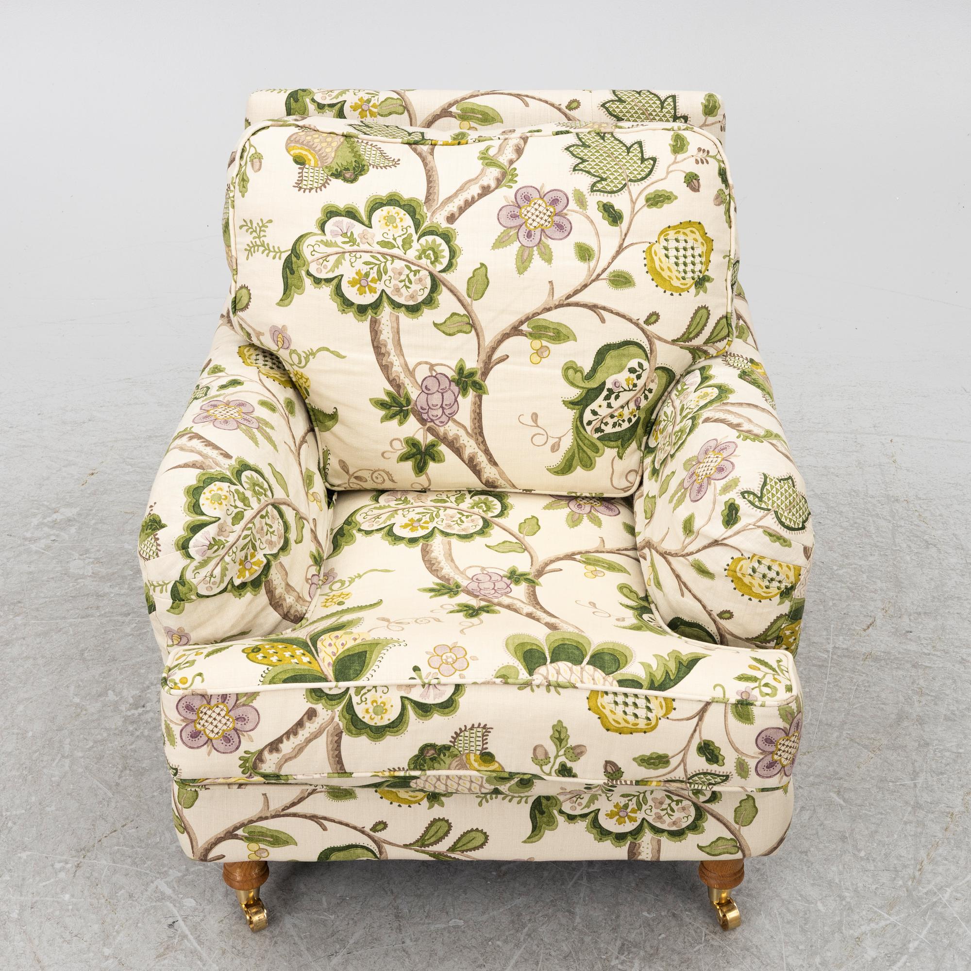 A 'Howard' armchair with footstool, Englesson.