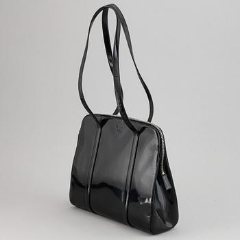 Prada, a patent leather bag.