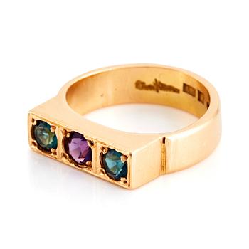 Wiwen Nilsson, an 18K gold ring set with amethyst and tourmaline, Lund 1968.