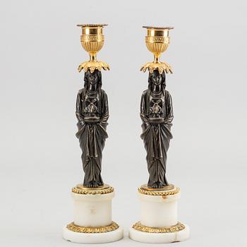 A pair of Louis XVI 18/19 century candlesticks.