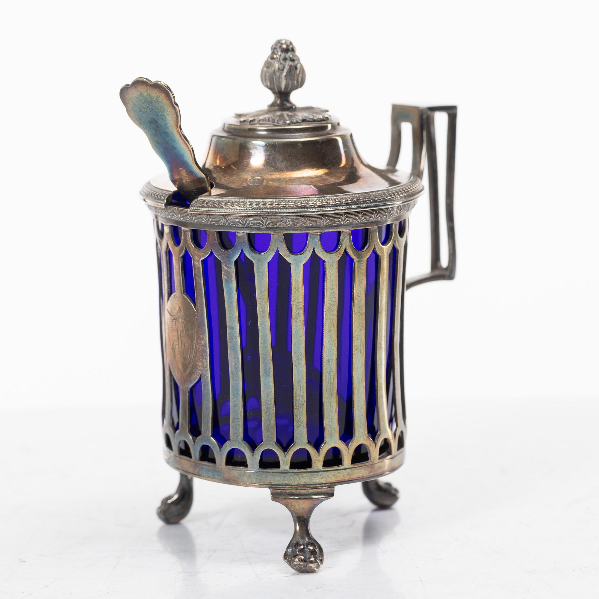 Two silver salt cellars, and a mustard pot, French hallmarks, late 18th Century.