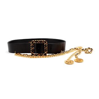 CHANEL, a black leather belt with two chains.