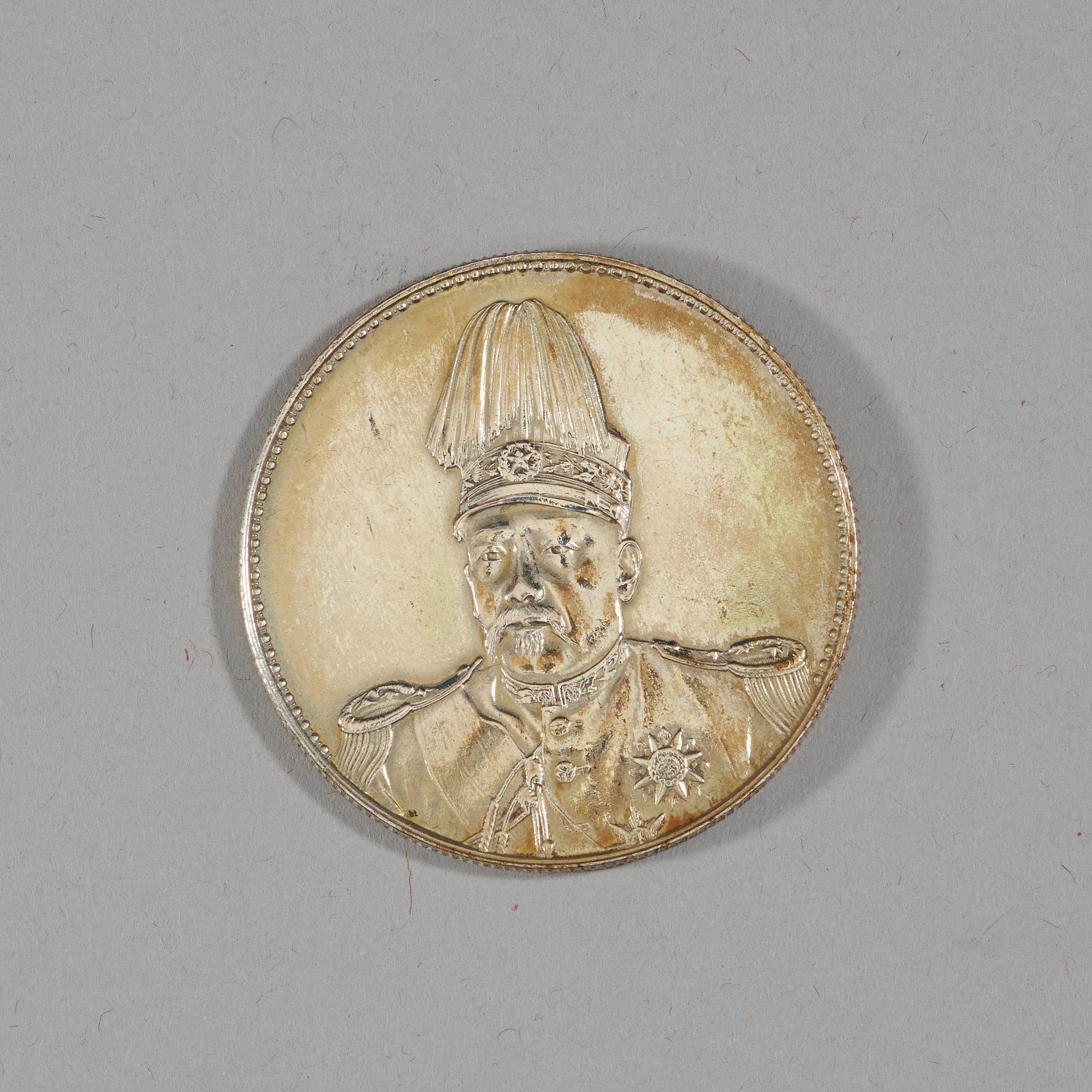A box with five silver coins, Republic, early 20th Century.