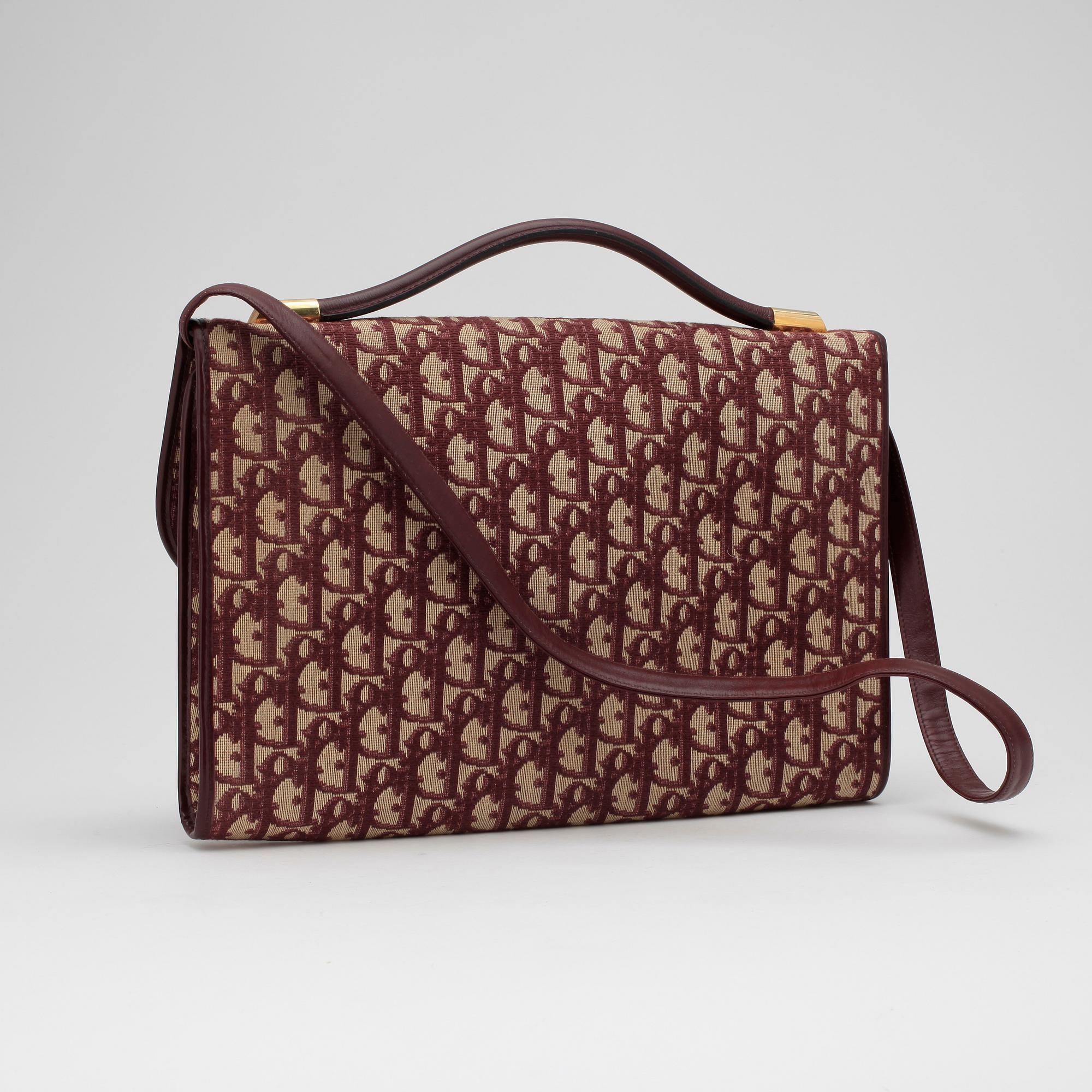CHRISTIAN DIOR a red monogram canvas shoulder bag. Bukowskis