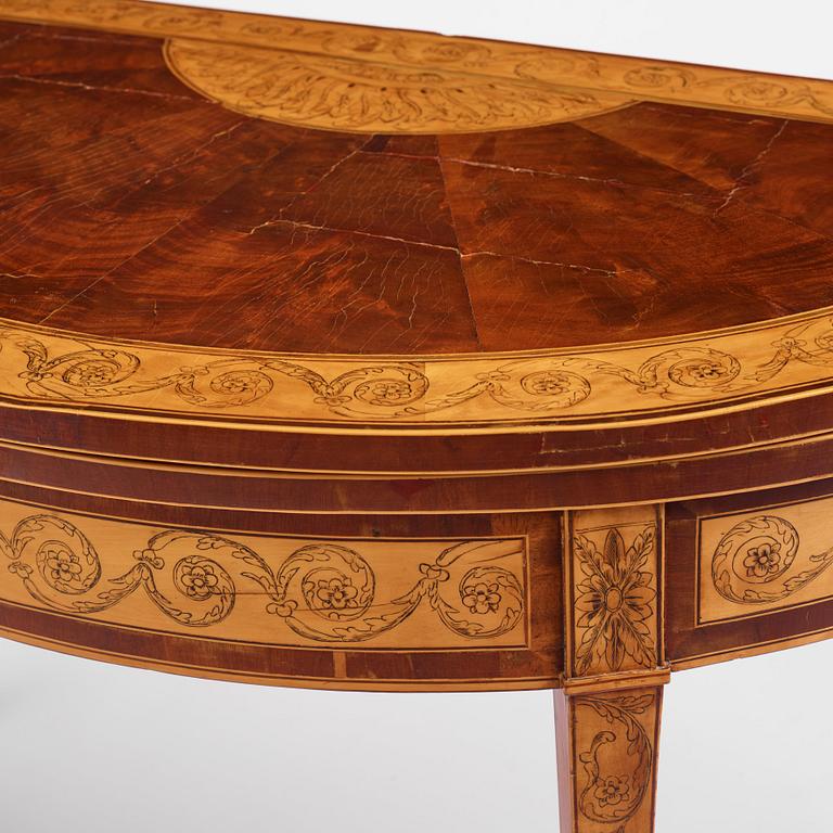 A Russian Louis XVI mahogany and birch parquetry demi-lune games table, late 18th century.