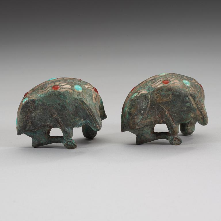Two archaistic bronze weights with stone inlay, China.