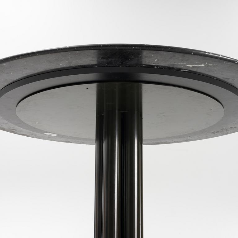 Louise Roe, a 'Roundabout' dining table with marble top.