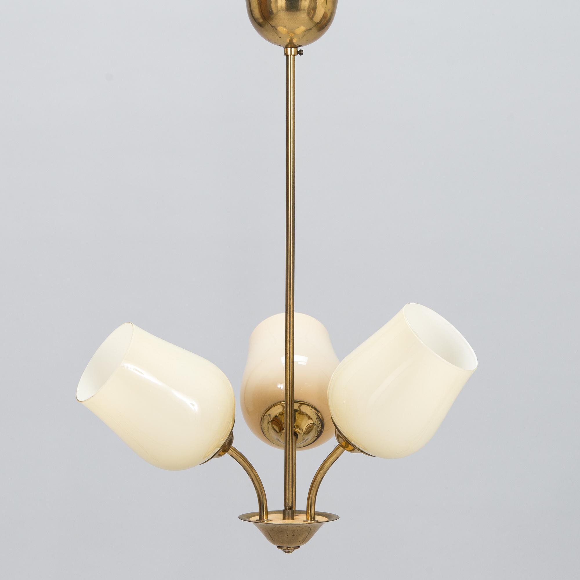 A mid 20th century brass pendant ceiling light, manufactured by Itsu, Finland.