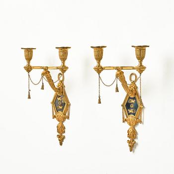 A pair of two-branch late Louis XVI ormolu and blued steel appliques attr. to F. Rémond (bronzier in Paris 1774-1812).