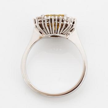 Princess-cut colour treated fancy deep brown-yellow diamond ring.