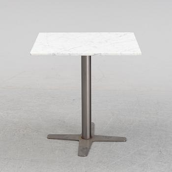 A marble top table, 21th century.