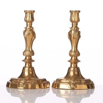 A pair of French Louis XV 18th century gilt bronze candlesticks.