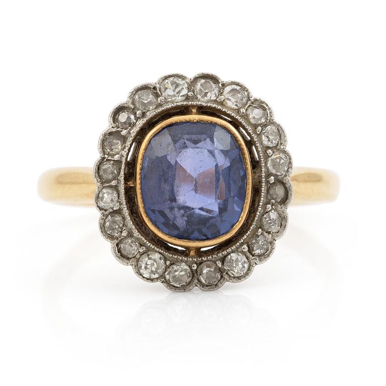 A ring in gold with a cushion-cut purple sapphire and old-cut diamonds, ca first half of the 20th century.