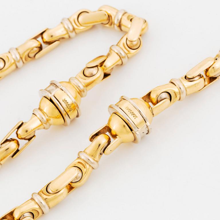 An 18K gold necklace/bracelet combination.