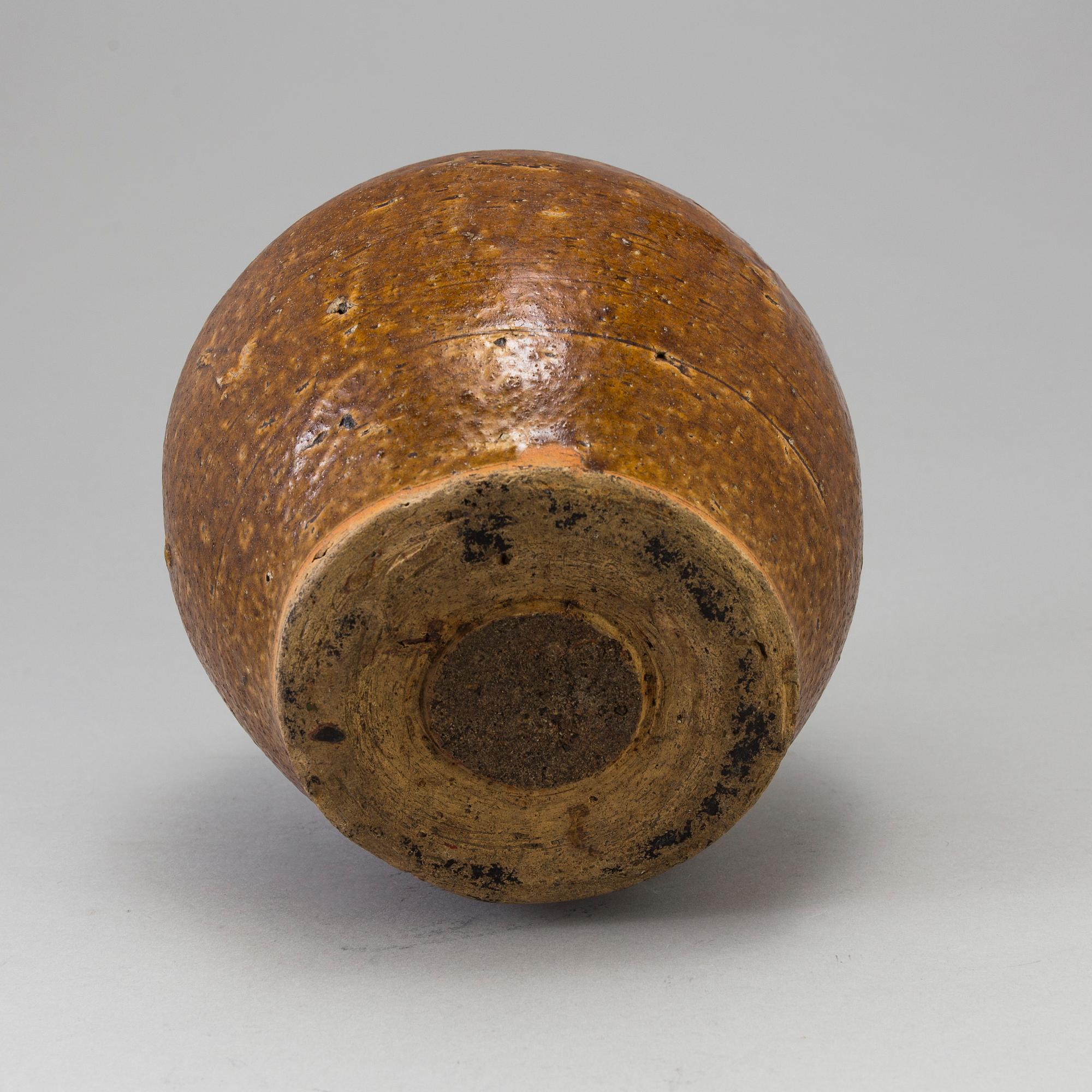 A south east asian pottery urn 18/19th century.