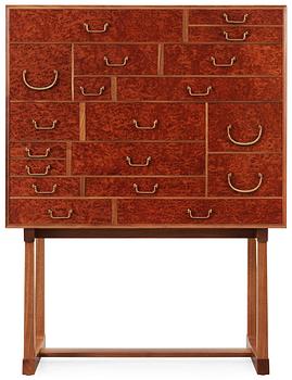 323. A Josef Frank cabinet on stand, model nr 881, by Svenskt Tenn.