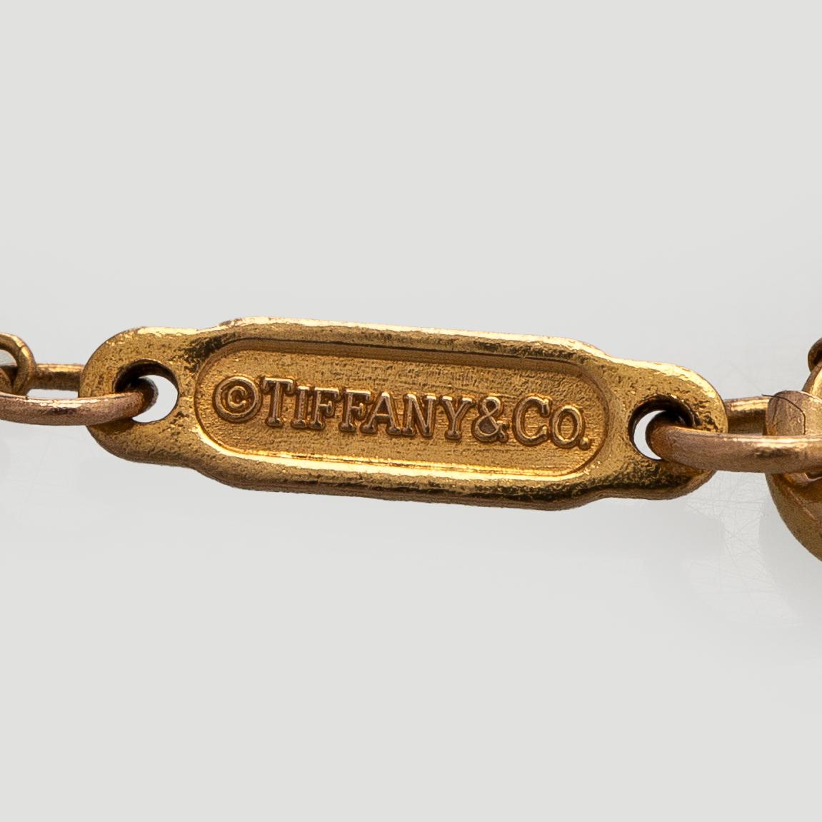 Tiffany & Co, armband, 18K guld med en briljantslipad diamant.