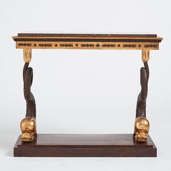 A Swedish Empire porphyry and giltwood console table, early 19th century.