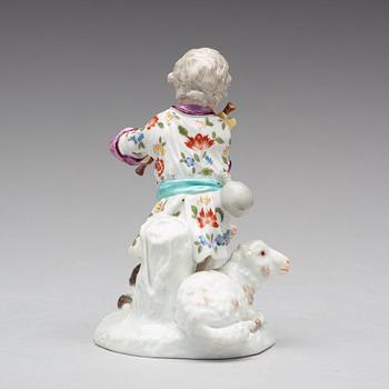 A Frankenthaler porcelain figure of a putto playing bag pipe, Germany, 18th Century.