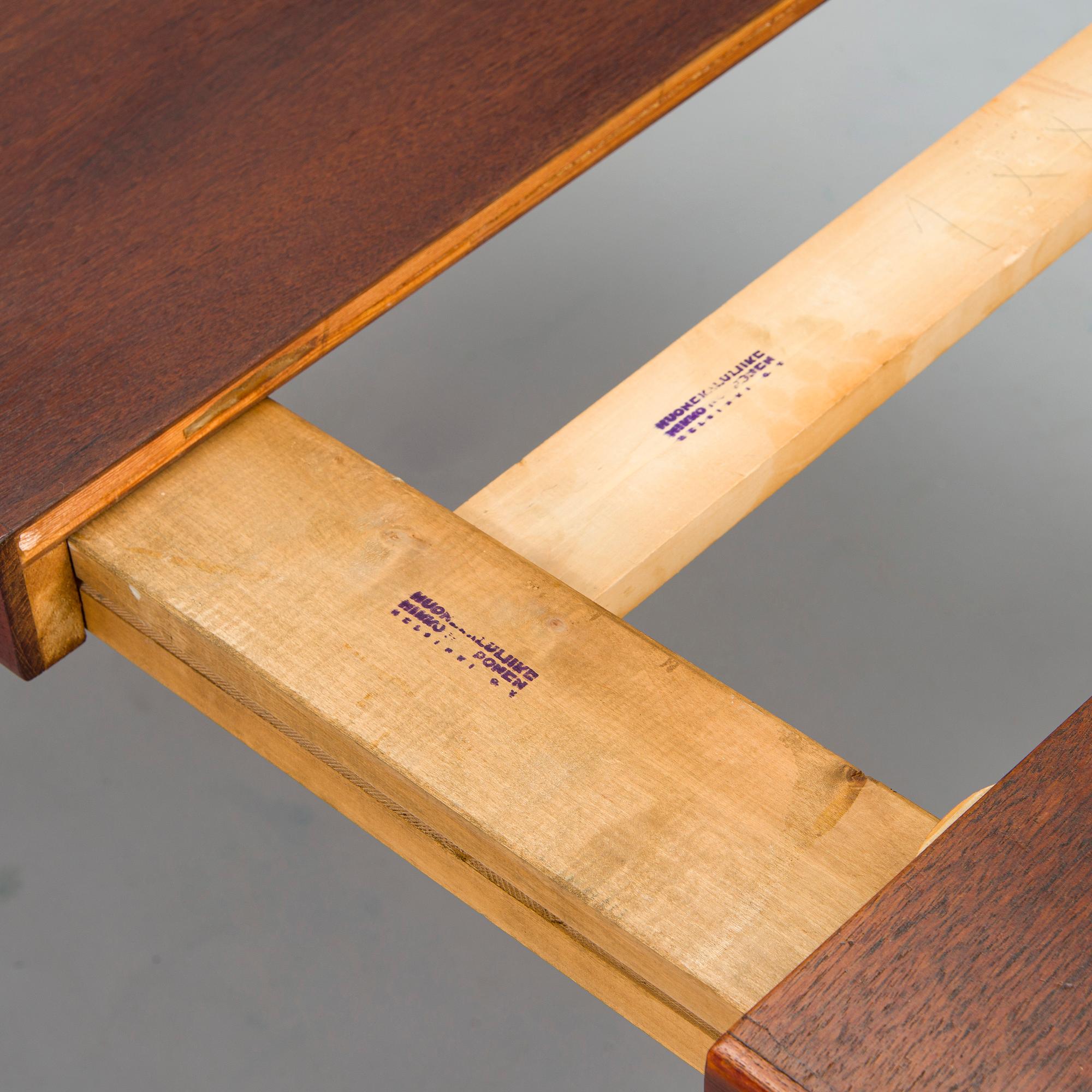 Carl Gustaf Hiort af Ornäs, a mid-20th-century 'Näyttely Senior' dining table and 12 chairs for HMN Huonekalu Nupponen.