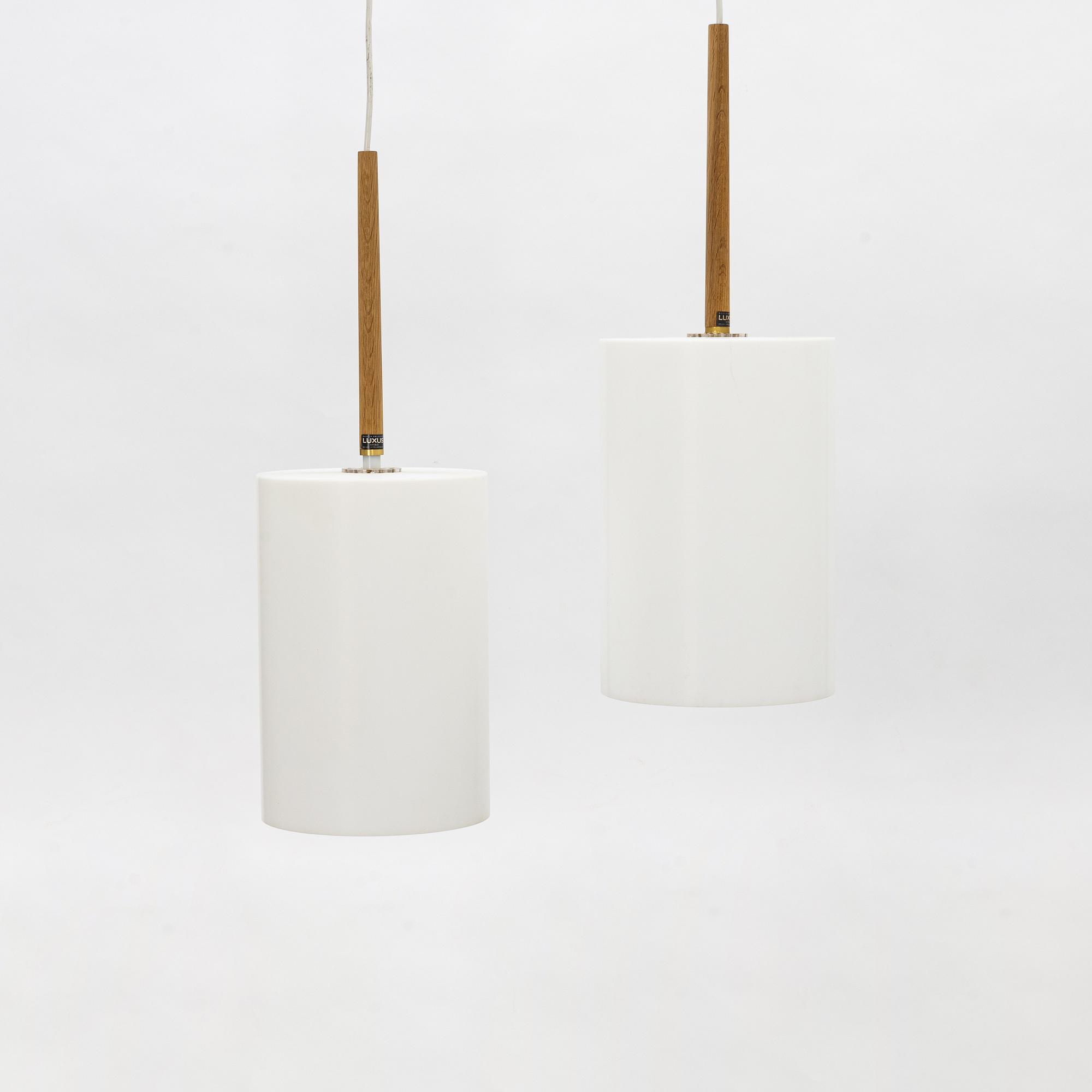 Uno & Östen Kristiansson, a pair of acrylic and oak ceiling lights, Lucus, Vittsjö.