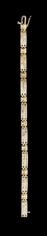 A gold and diamond bracelet.