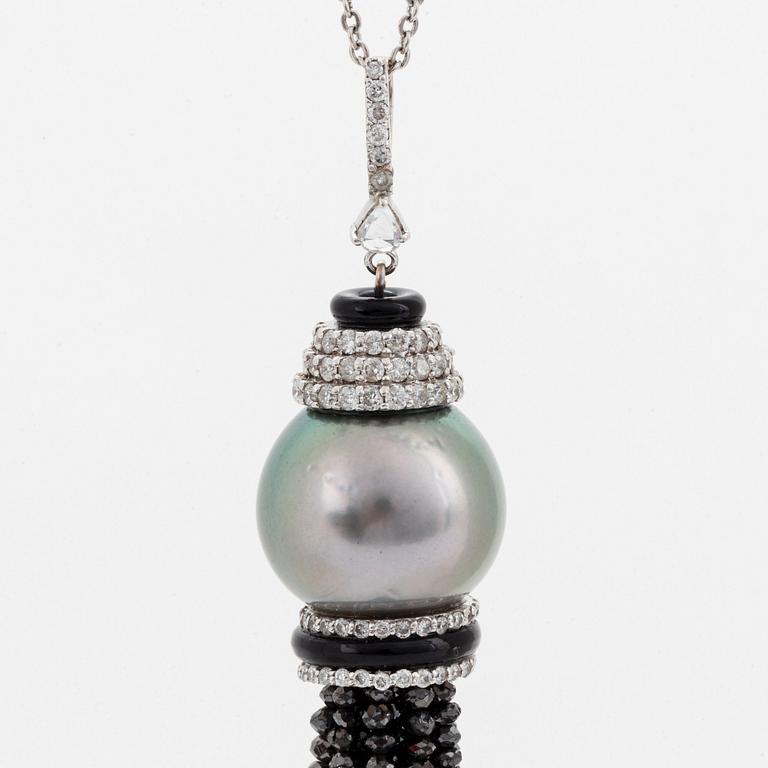 An Ebba Brahe 18K white gold tassel pendant with a cultured Tahitian pearl and white and black diamonds.