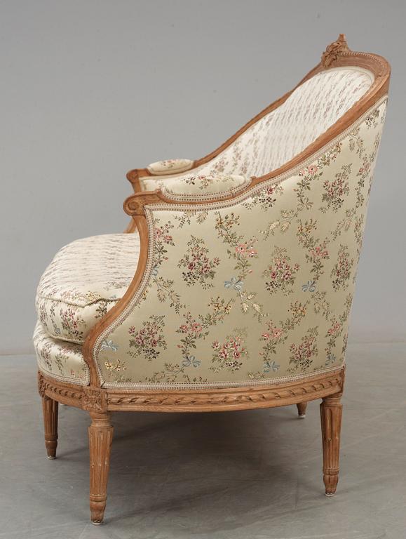 A Louis XVI 18th century sofa. Two later armchairs included.