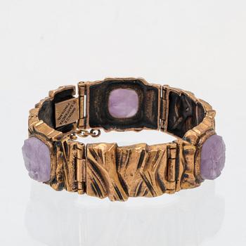 A bronze bracelet set with amethysts by Pentti Sarpaneva.