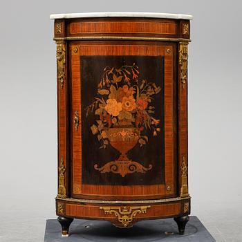 A 19th century corner cabinet.