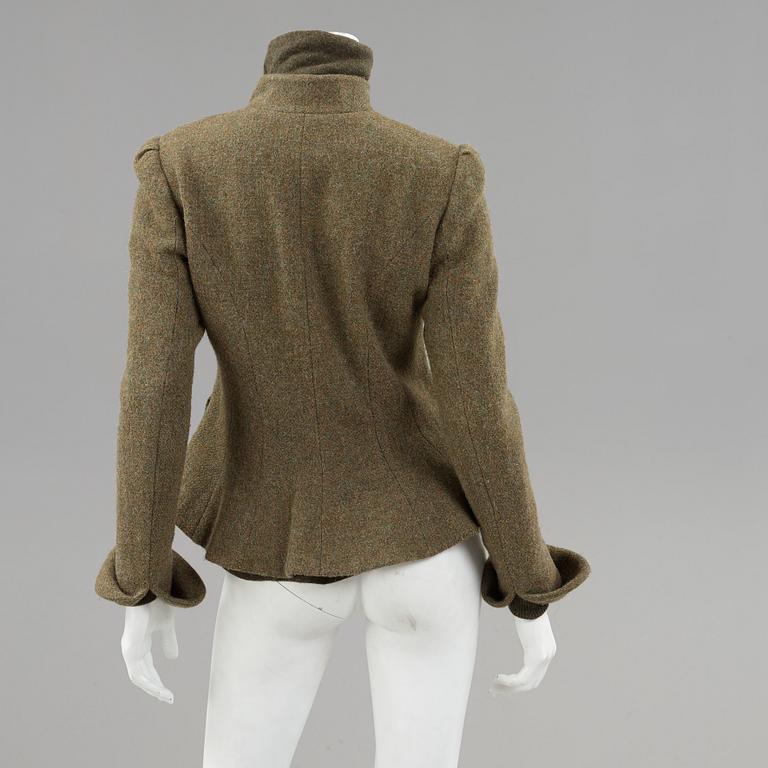 Green wool jacket and a turtleneck by Ralph Lauren.