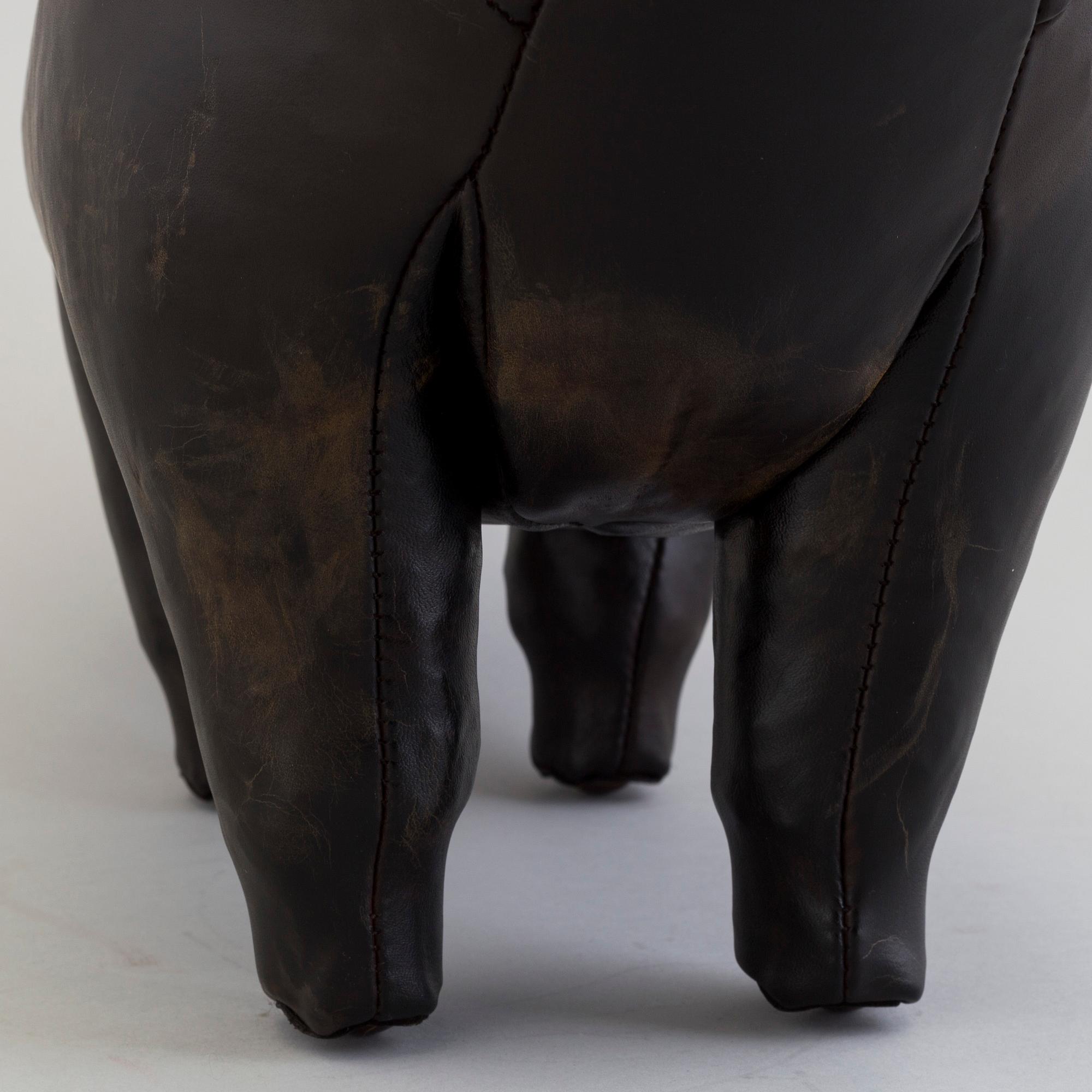 DIMITRI OMERSA & CO, a leather stool in the shape of a bull.