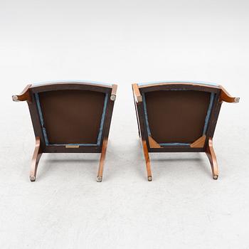 A pair of Baltic late Empire mahogany open armchairs, ca 1840.