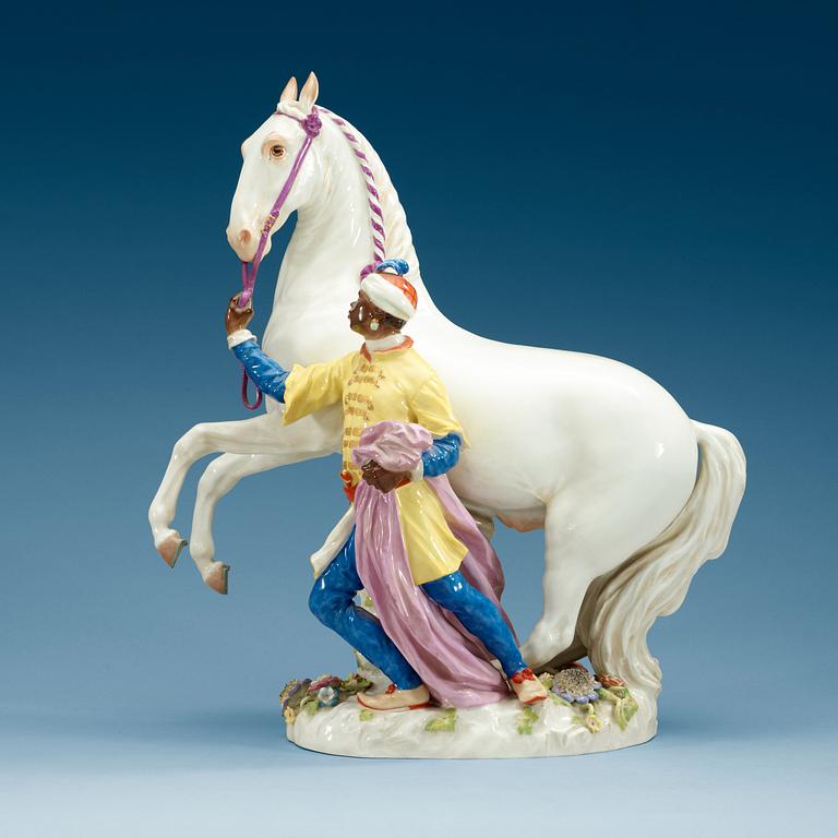 A large Meissen figure of a white horse and his groom, 20th Century.