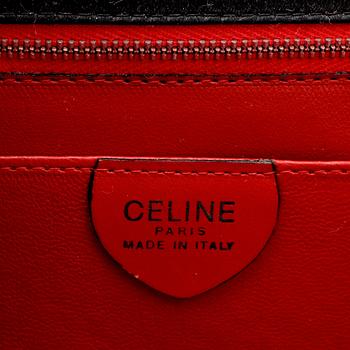 CÉLINE, a black satin eveningbag / clutch.