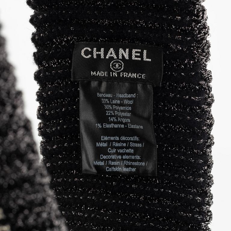 Chanel, a rhinestone headband.