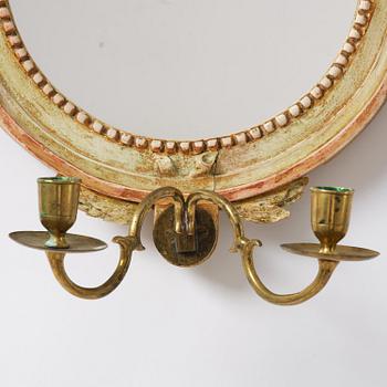 A pair of Gustaviantwo-branch giltwood girandole mirrors by C. G. Fyrwald (master in Stockholm 1776-1825).