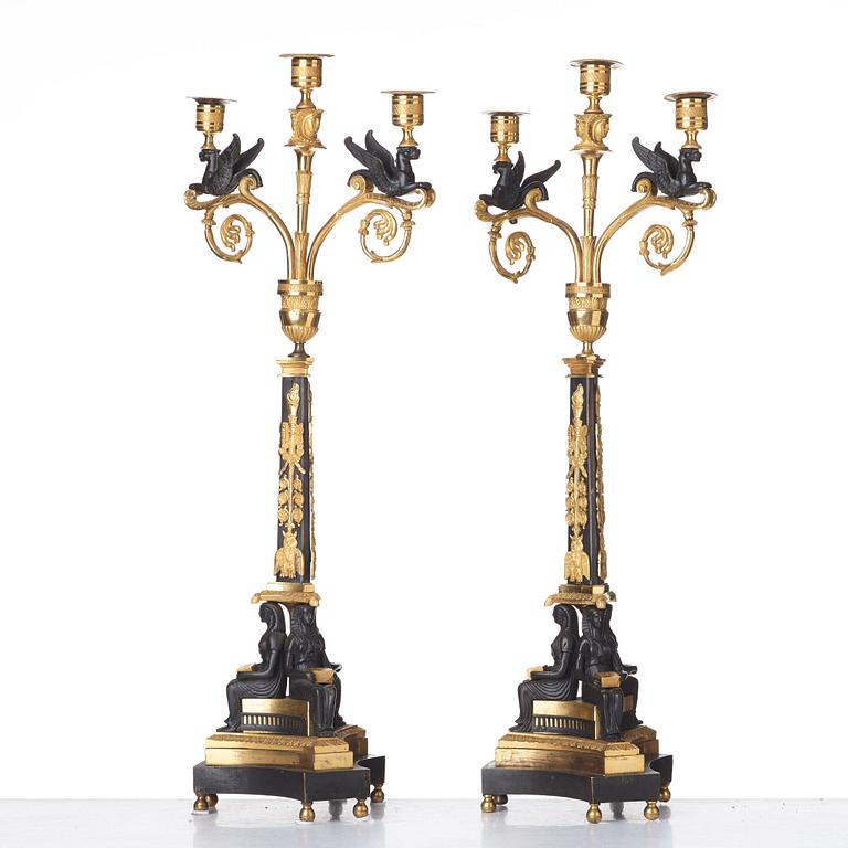 A pair of three-light Empire candelabra, early 19th century .